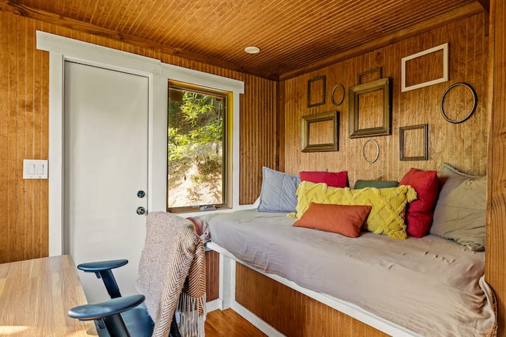 Daybed nook with empty picture frame wall